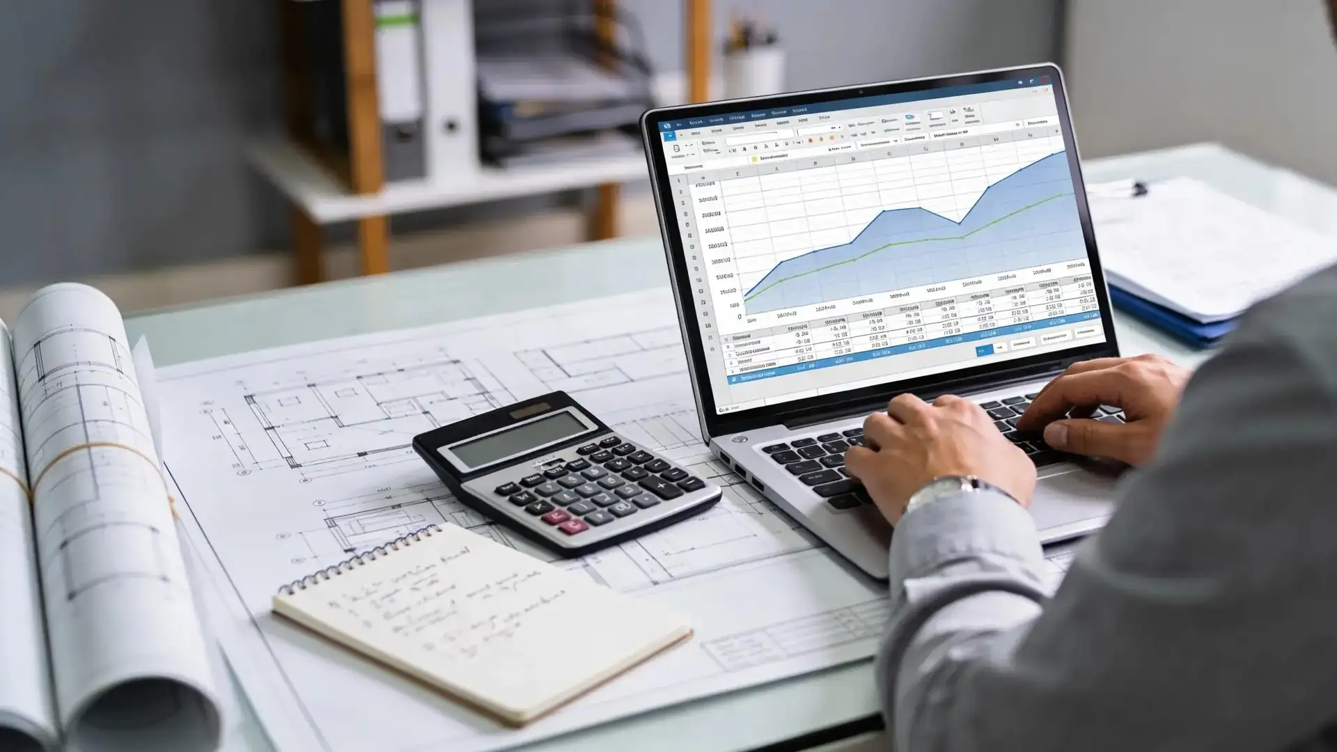 Construction cost planning process with a professional reviewing budgets and documents, emphasizing best practices in cost management